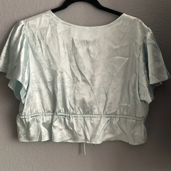 Blue floral print tie top. Some mild fabric pulls. - Picture 2 of 2